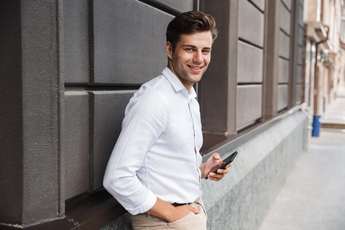 Man using his phone to make an online connection